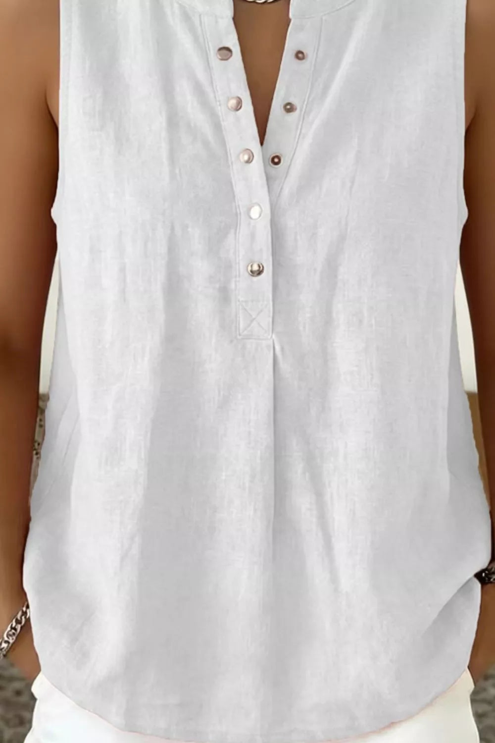Sleeveless snap front top side view
