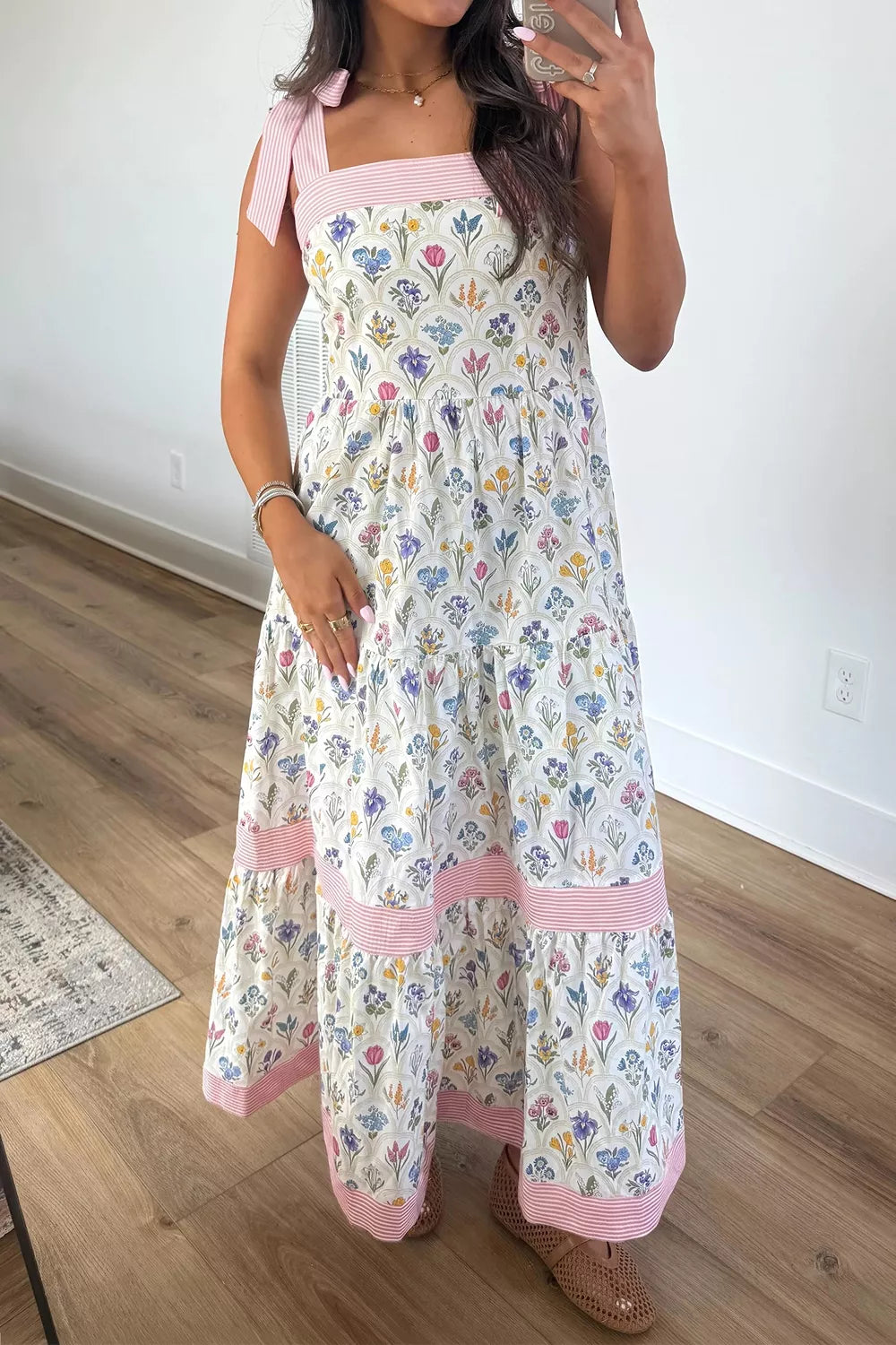 Tiered skirt detail on white floral midi dress
