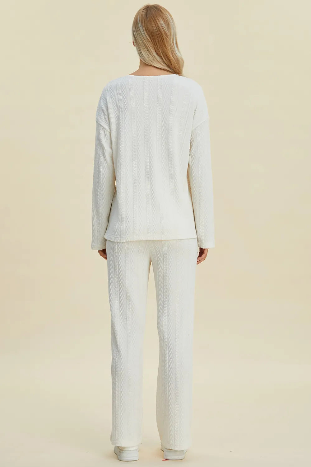 Close up of the button detail on the knit top