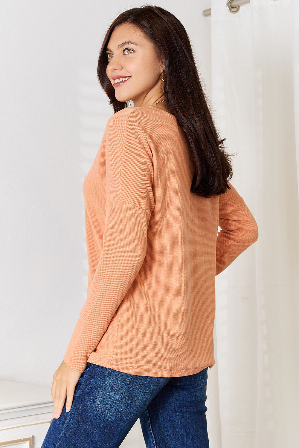 Side view of the half button top