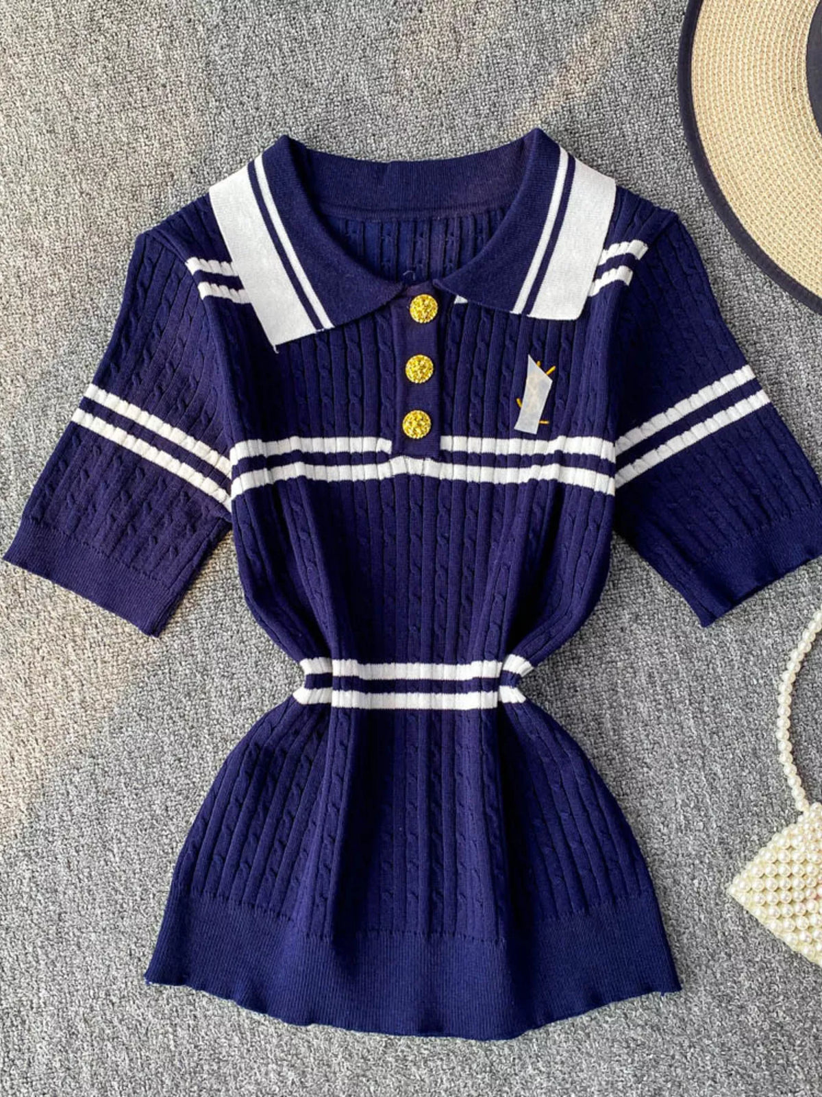 Striped knit polo collar top fabric detail view