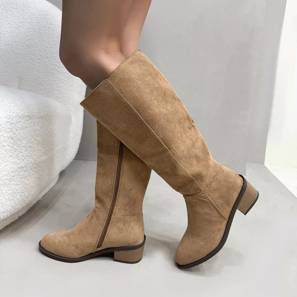 Knee high boots styled on model