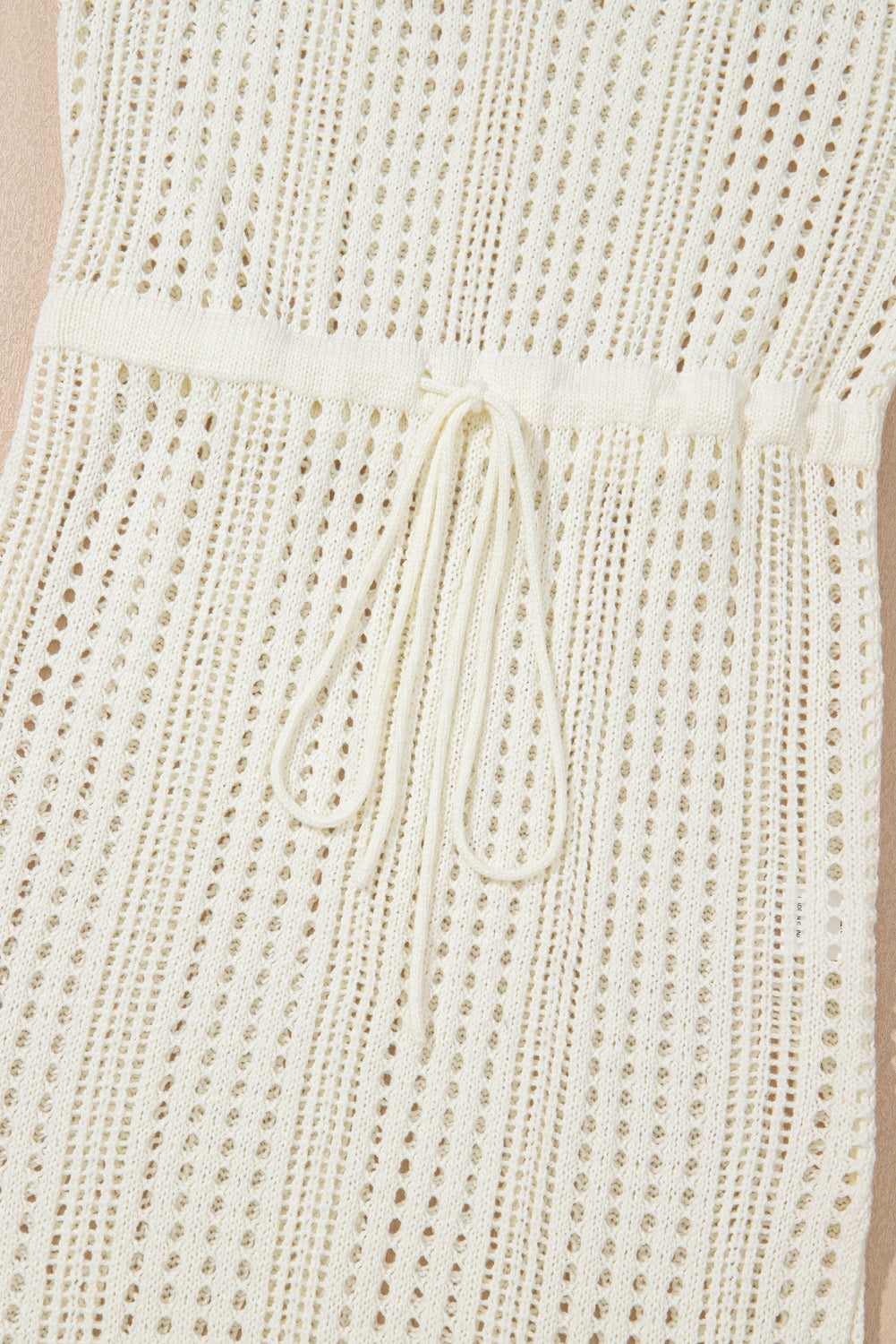 Beige knit cover up dress fabric texture close up