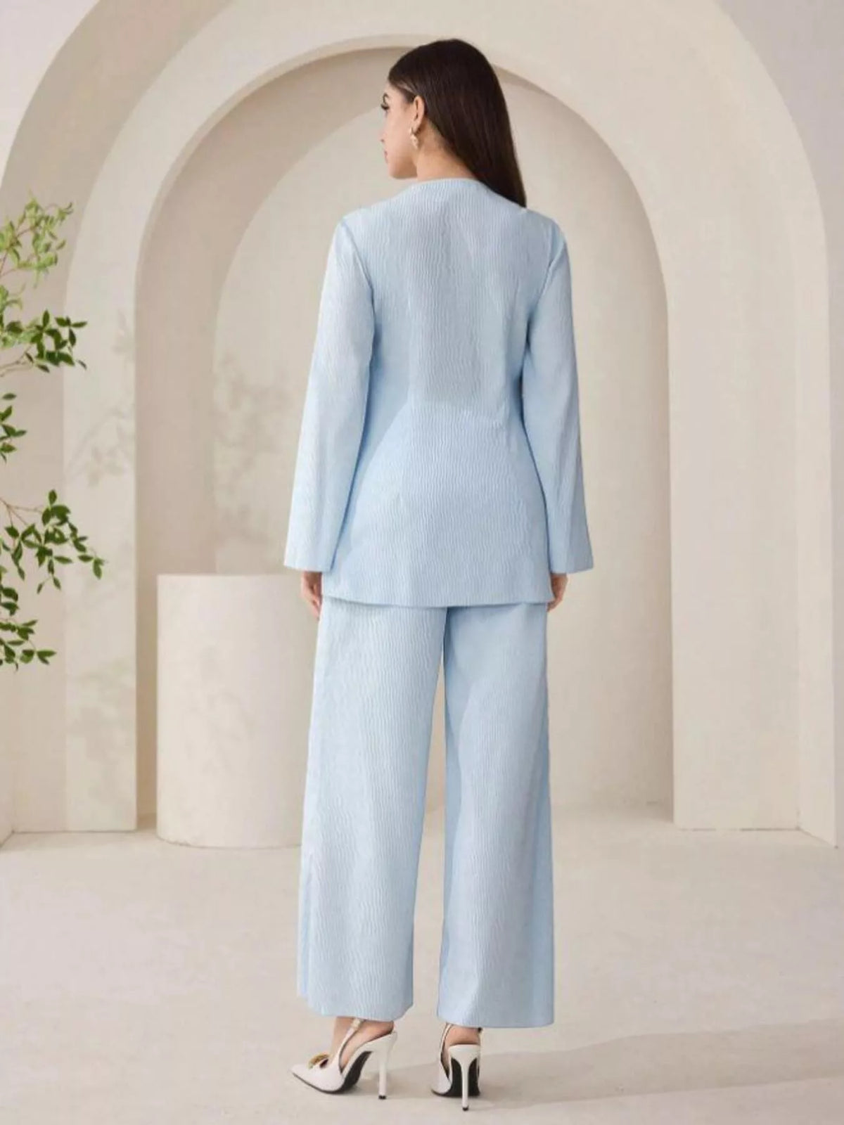Back view of blue shirt and pants matching set