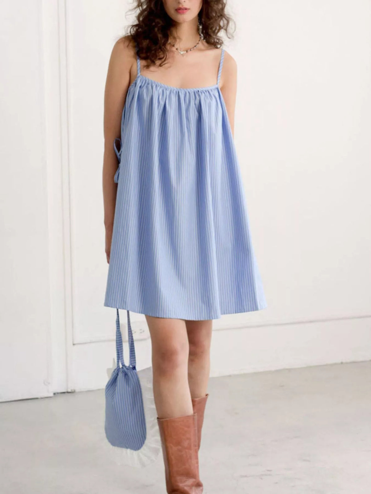 Polka dot mini dress shown in light blue