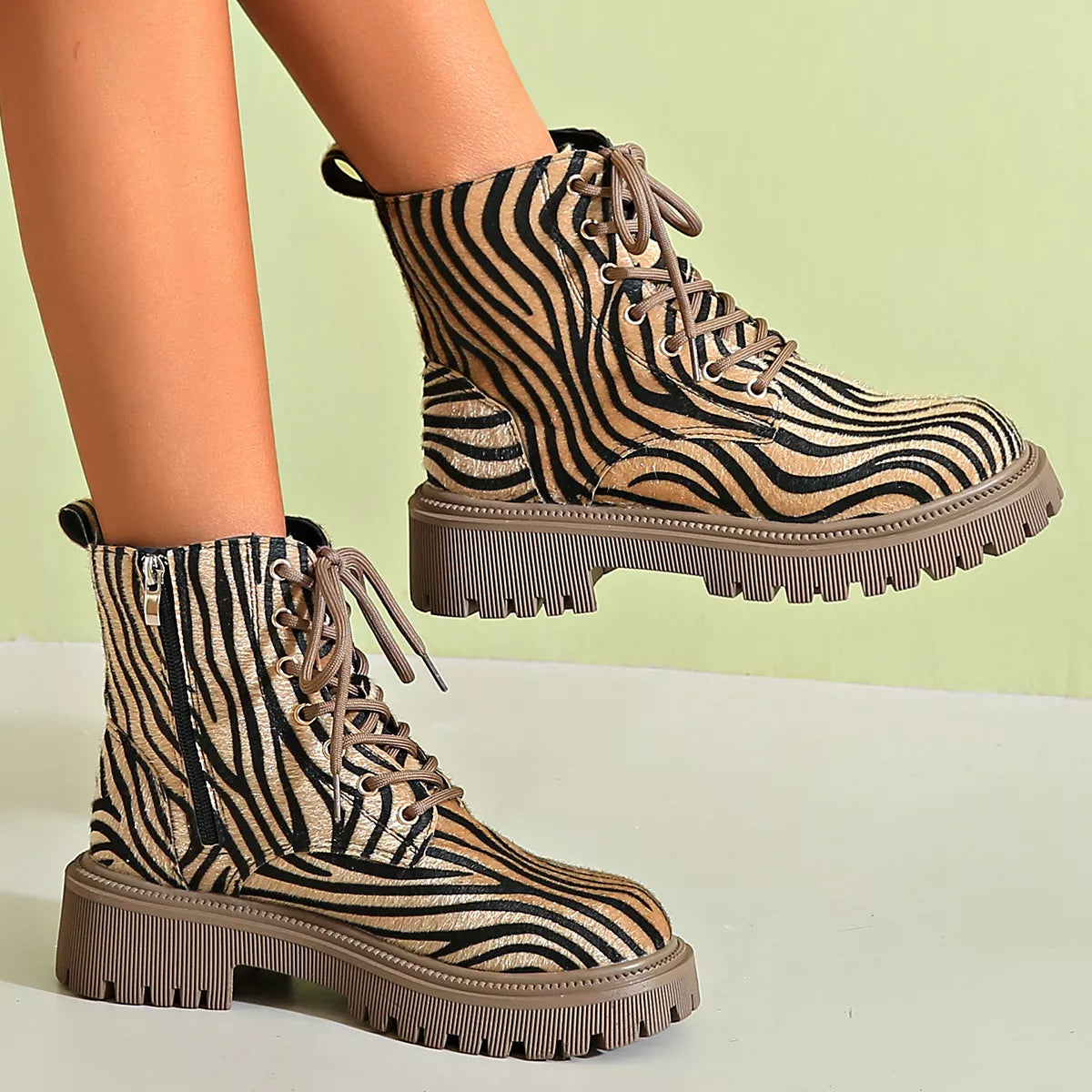 Animal print lace up ankle boots worn with denim