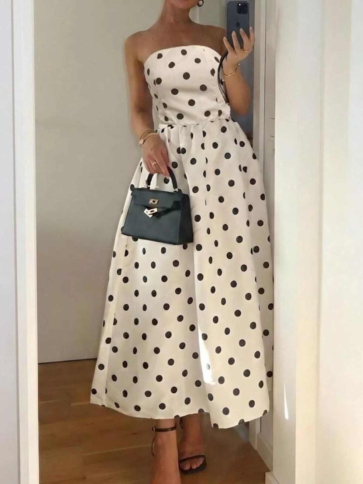 Cream polka dot strapless midi dress, side view