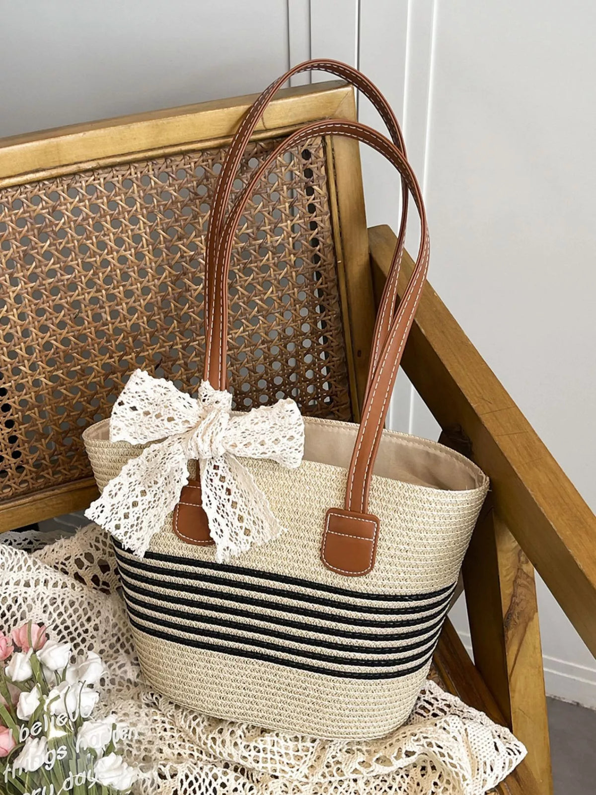 Off white straw bag with lace bow detail