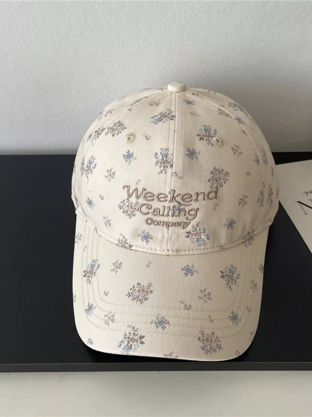 floral embroidered baseball cap on model