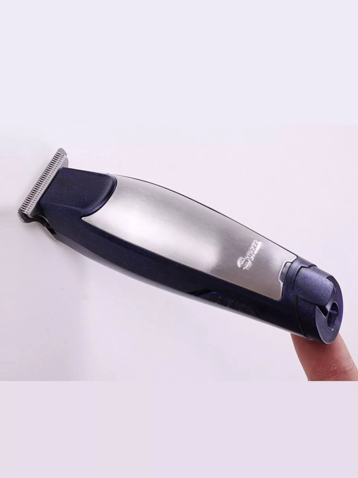 Cordless clipper held in hand