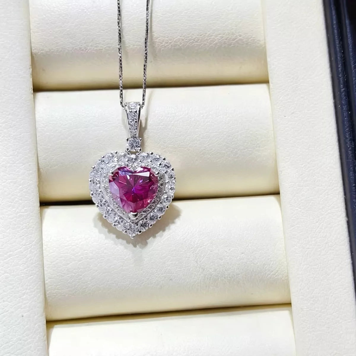 Moissanite necklace shown from the side on model
