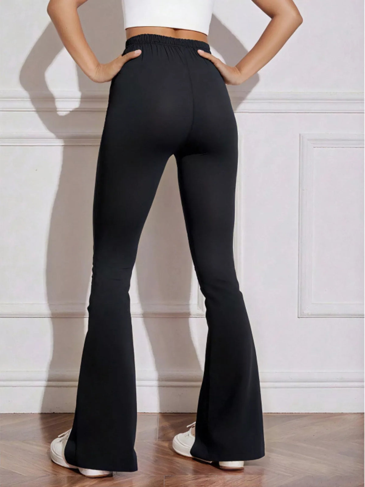 Black drawstring active pants styled with sneakers