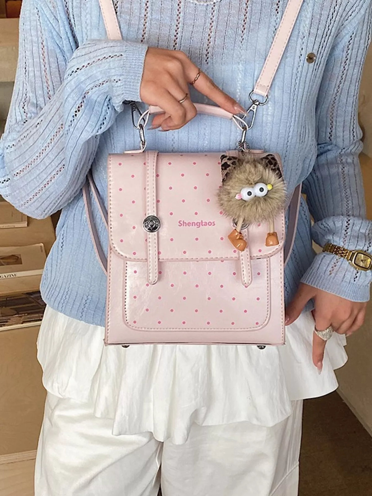Blush pink polka dot mini backpack back and straps