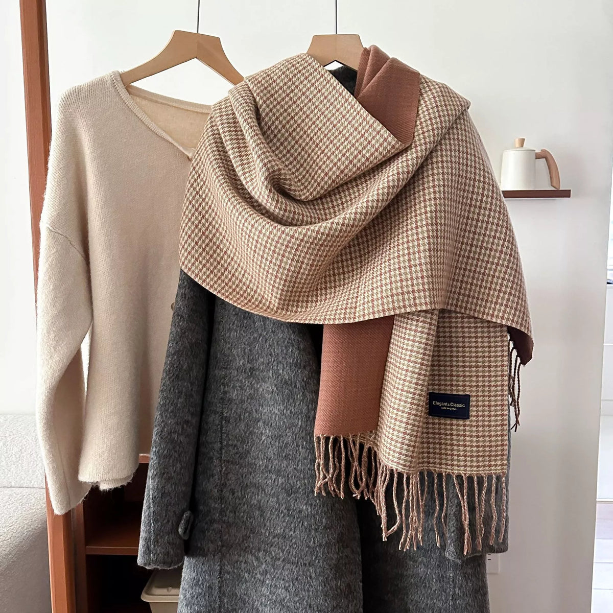 Plaid fringe warm winter scarf shown draped around the neck