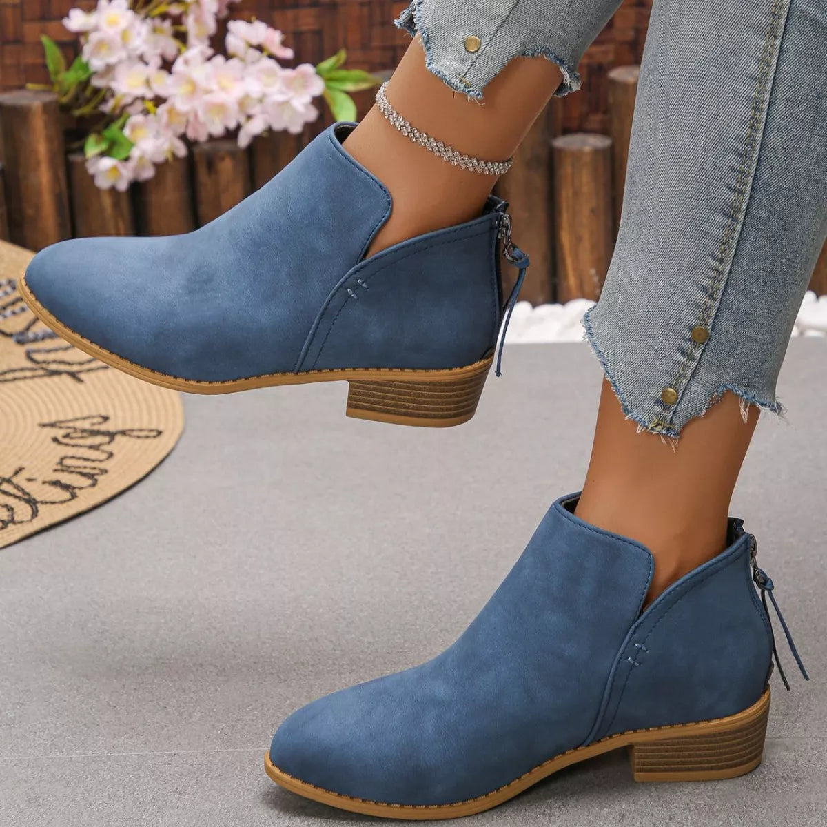 Point toe block heel ankle boots close up texture