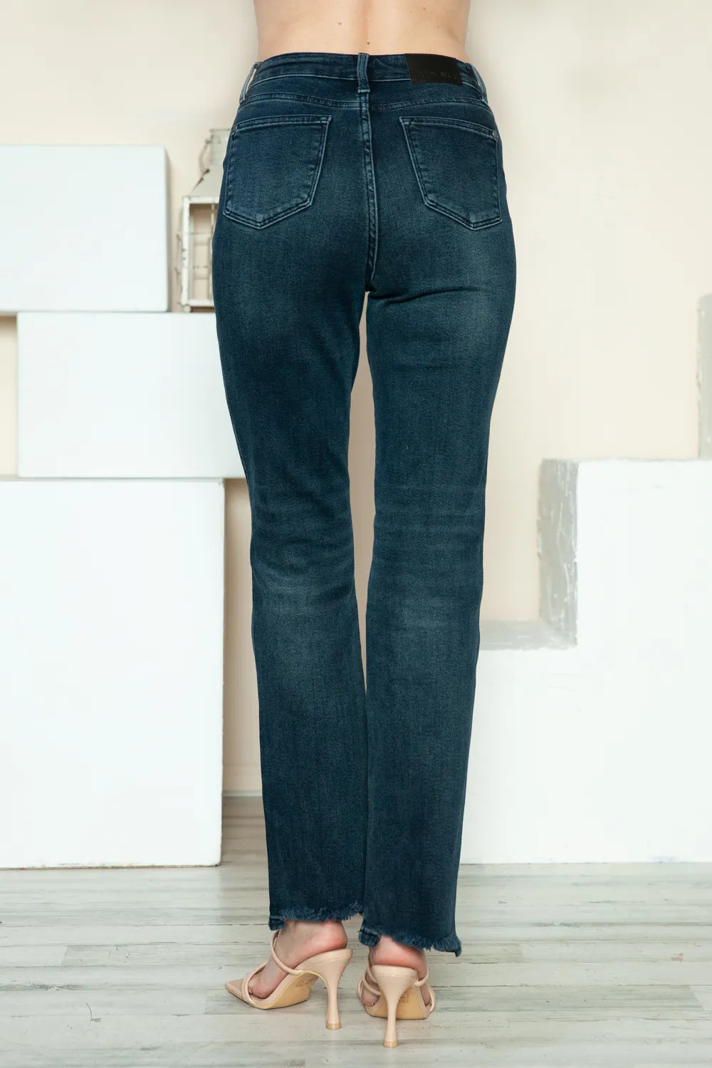 Distressed straight leg jeans shown from the side