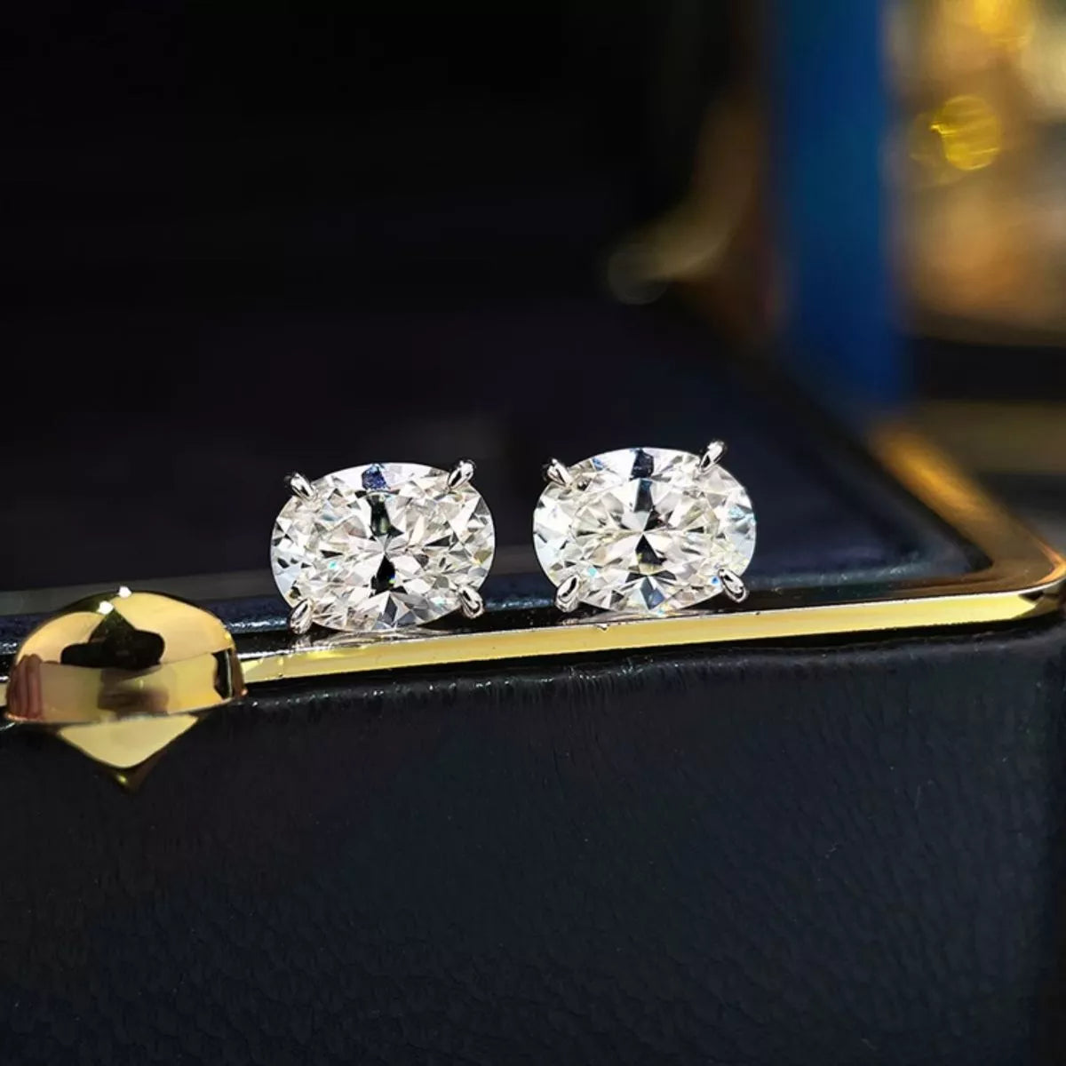 Moissanite stud shown close up on a plain ground