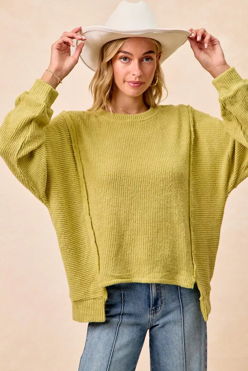 Lime green sweater styled with jeans