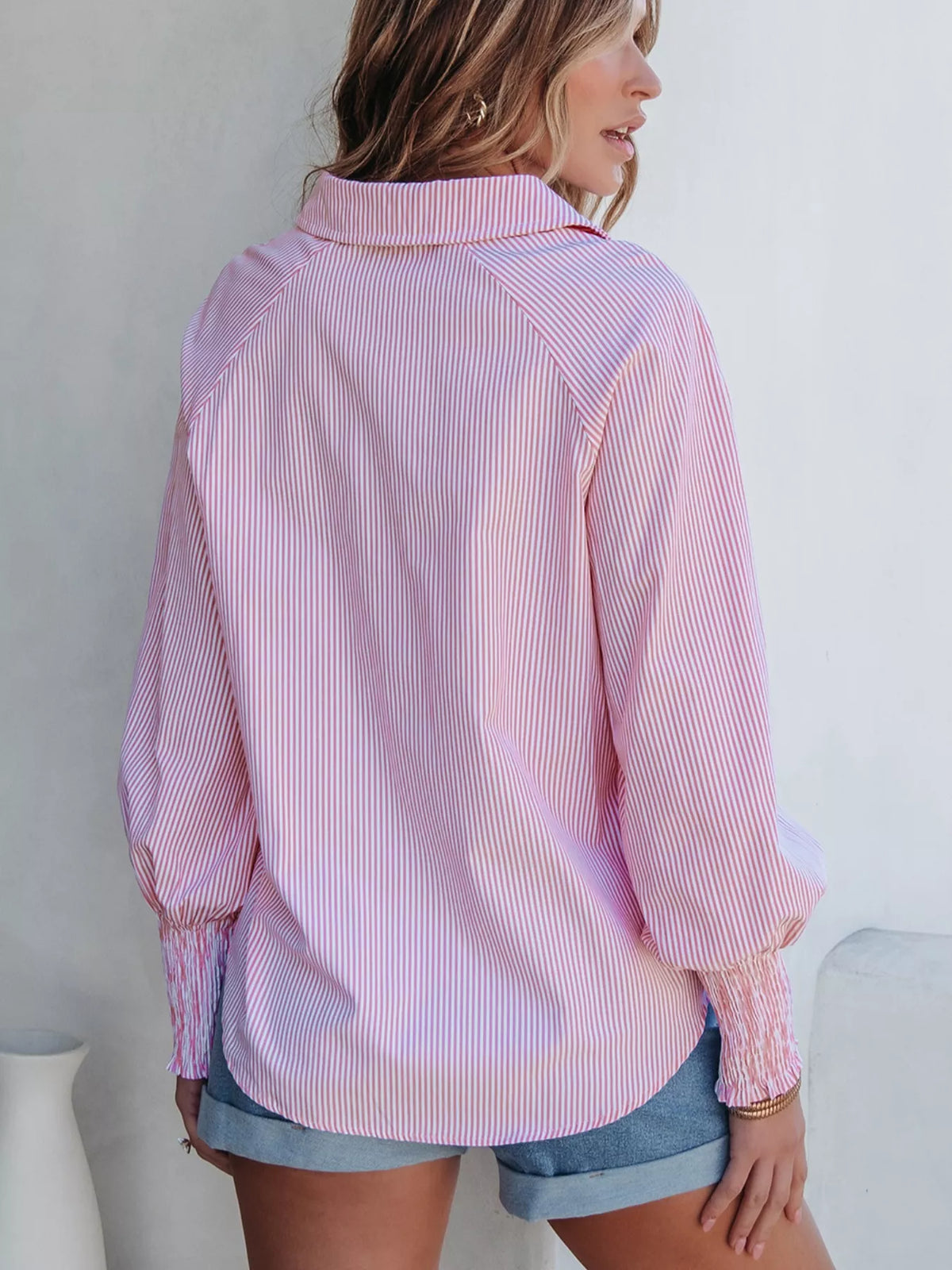 Pinstripe blouse styled with wide leg trousers