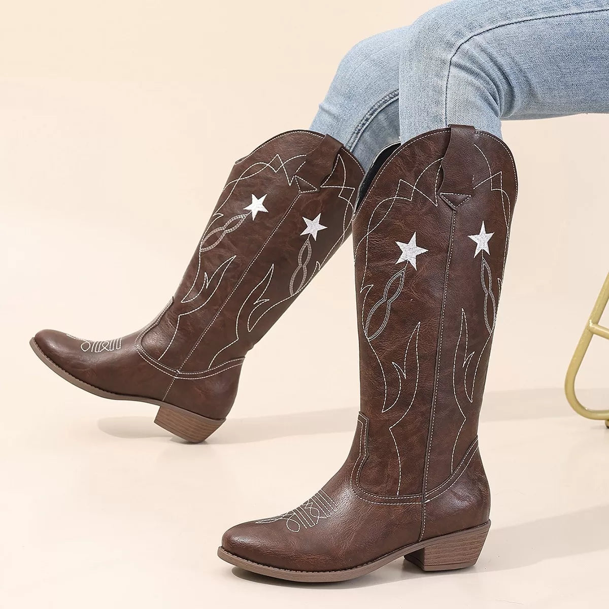 Western star embroidered cowboy boots sole view