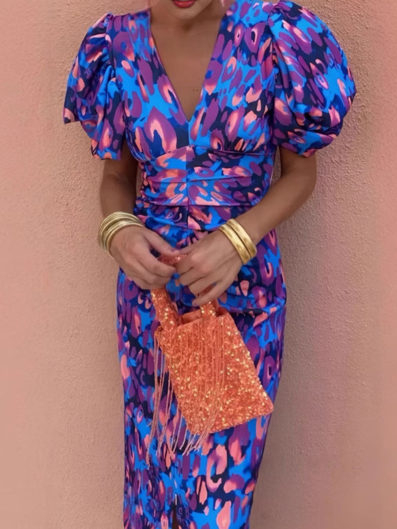 Model wearing the V neck puff sleeve ruched dress in a full length front view