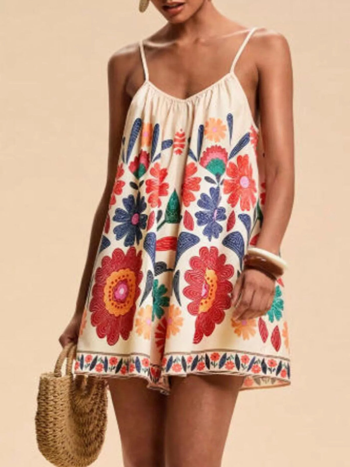 Red floral romper close up of the spaghetti straps