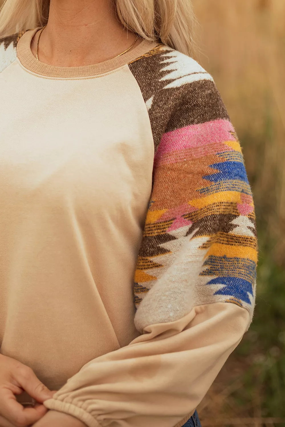 Detail of the aztec patchwork panel on the sweatshirt