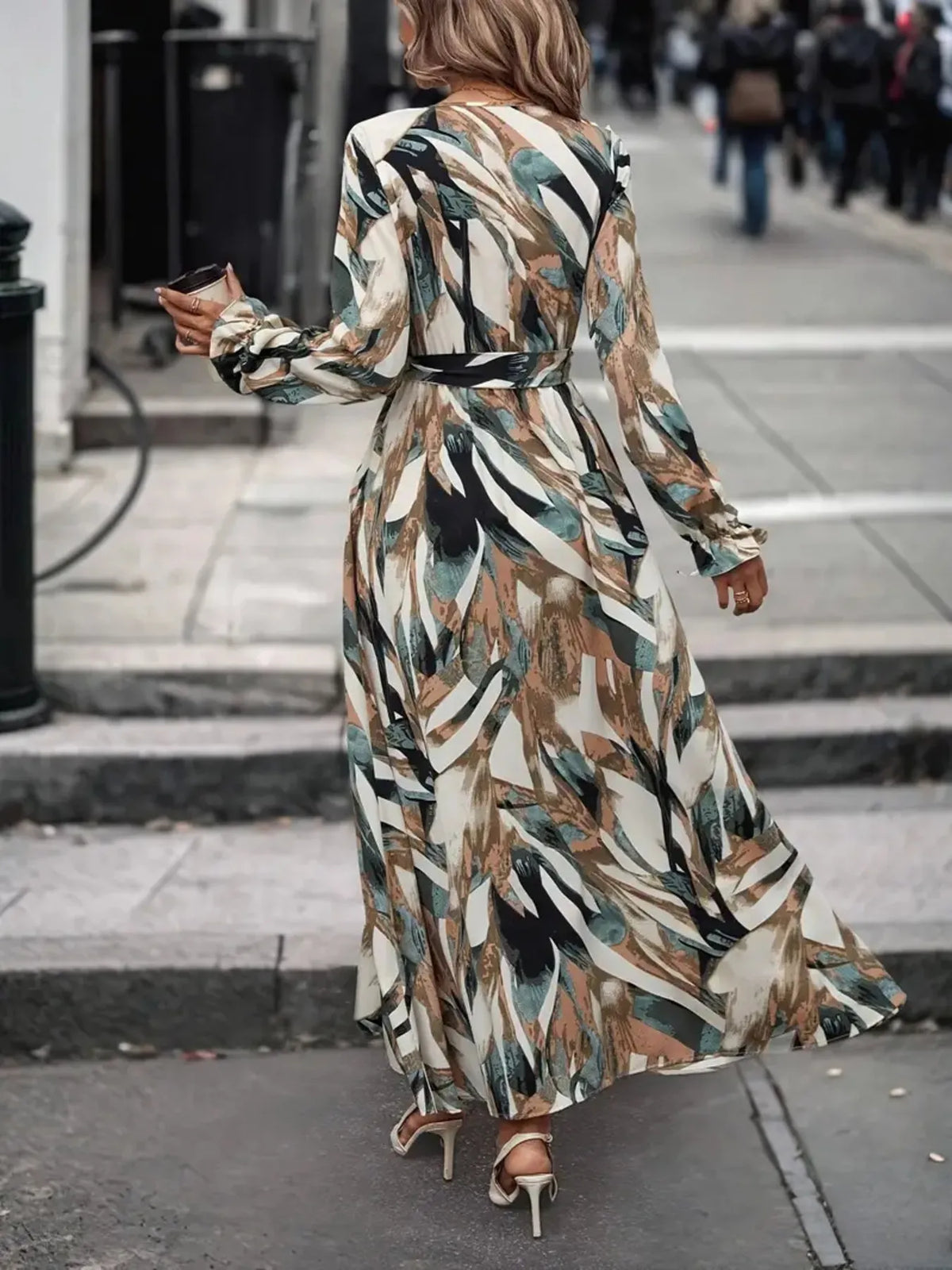 Printed surplice long sleeve maxi dress, skirt and hem detail