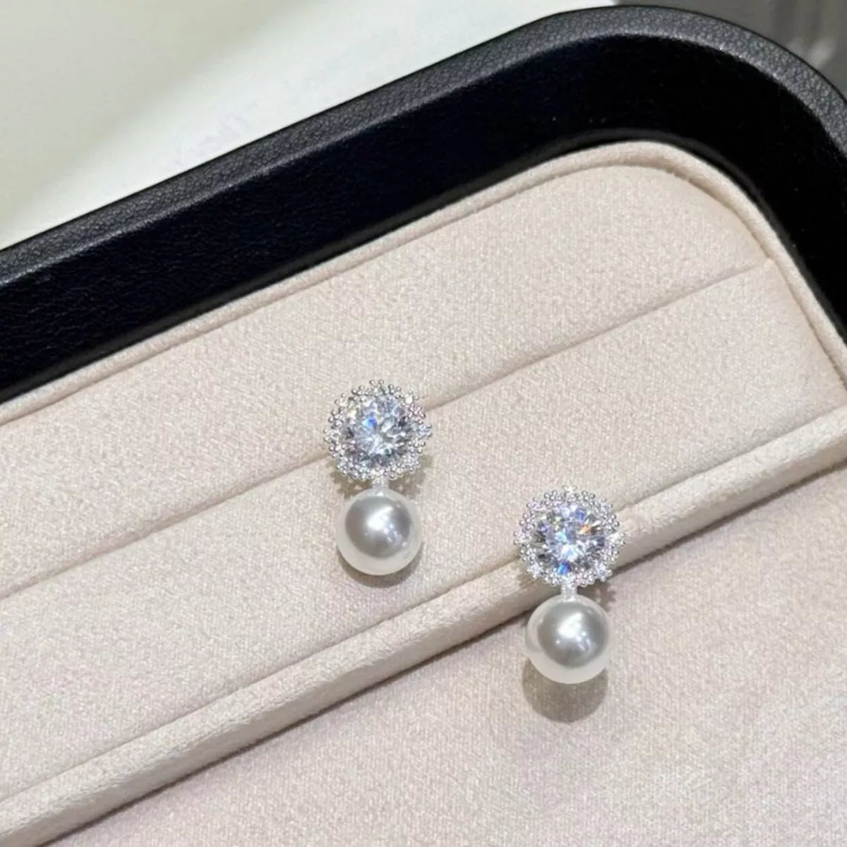 Pearl drop earrings with zircon detail
