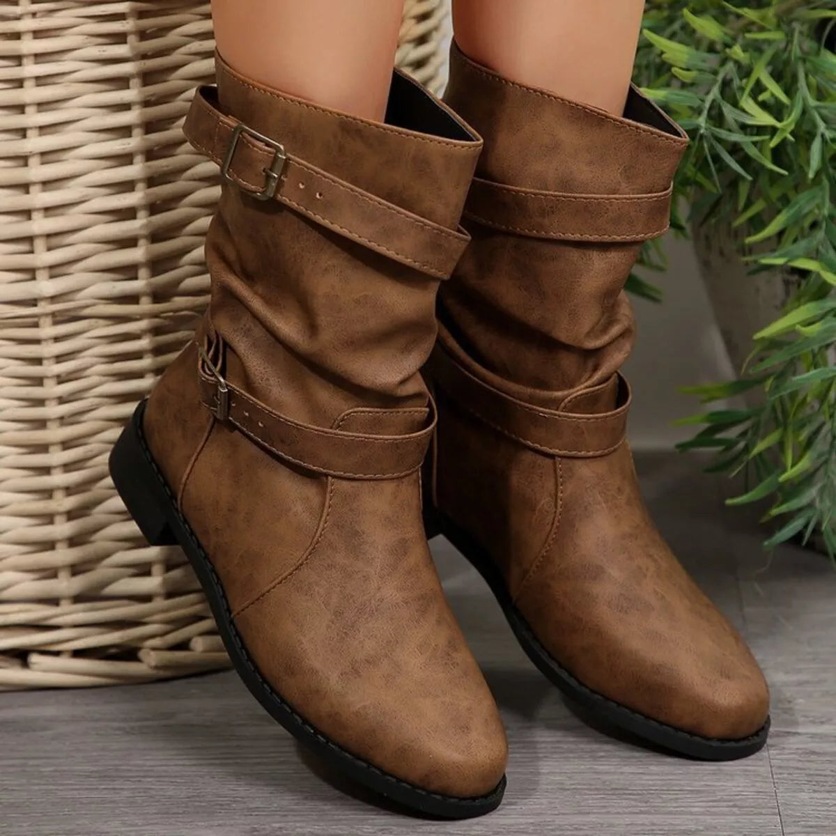 Buckled low heel boots front view