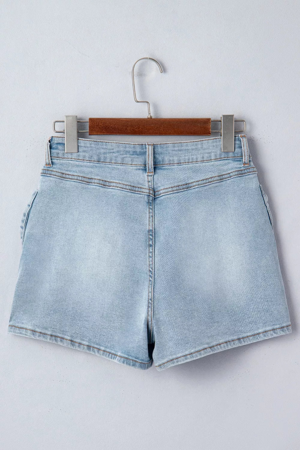 Light blue bow detail denim shorts full length view
