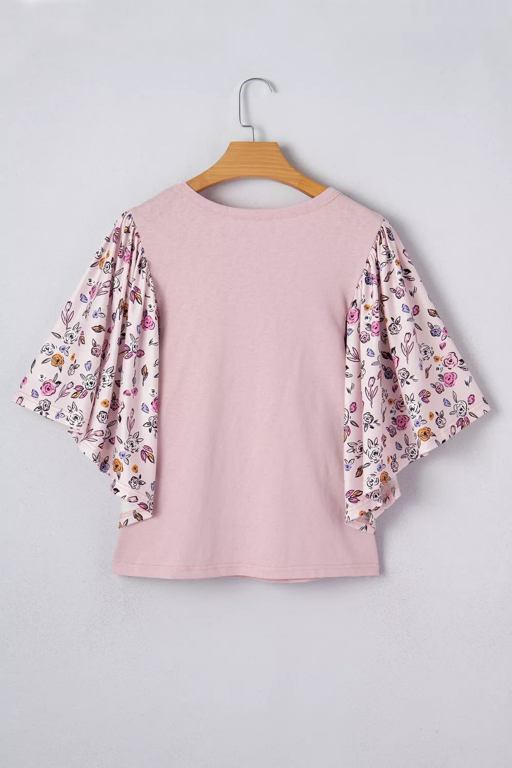 Dusty pink bell sleeve blouse neckline detail