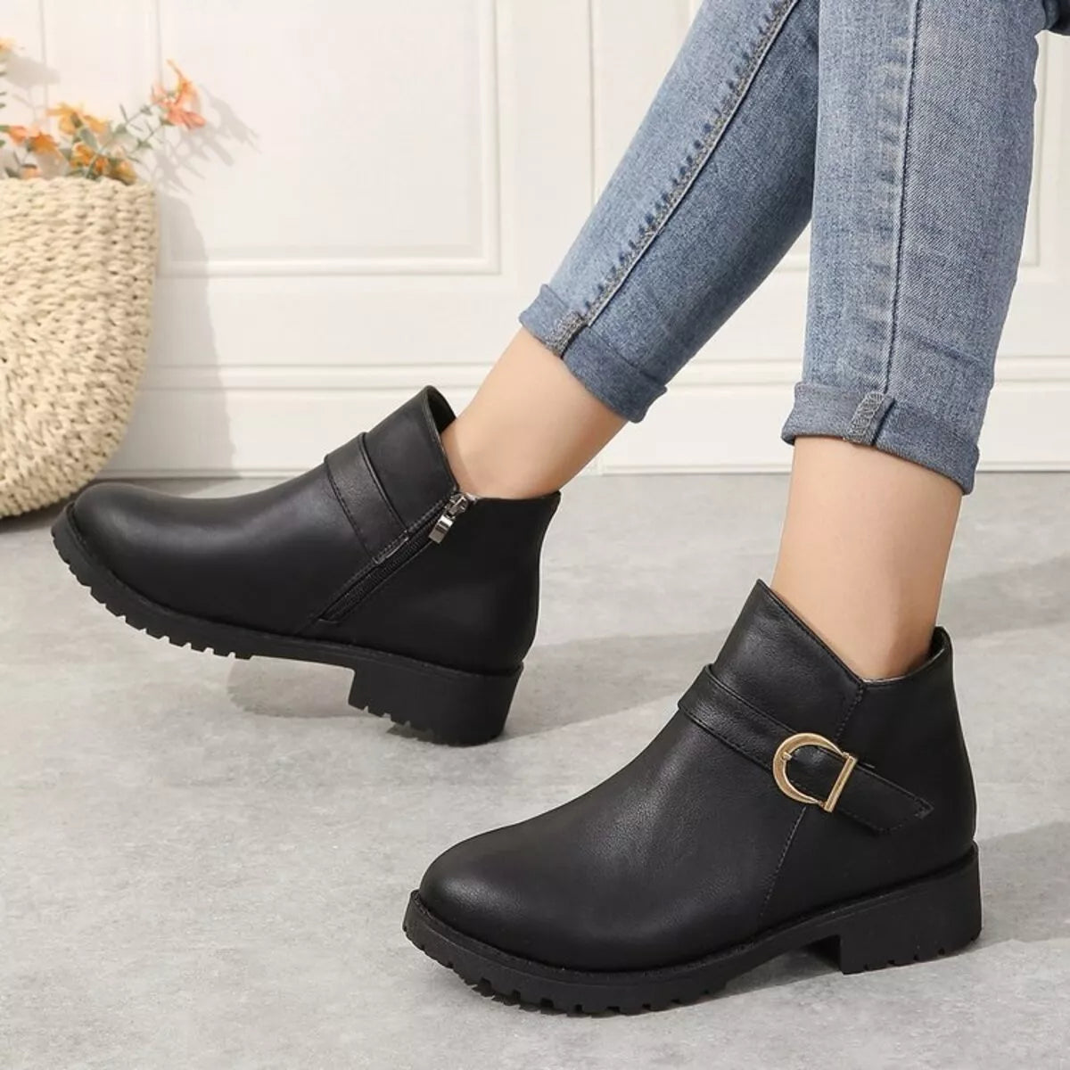 Buckle accent ankle boots pair styled together