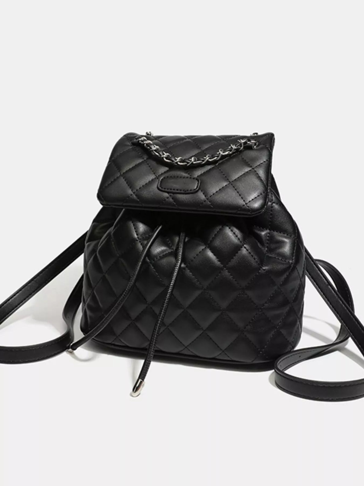 Black quilted chain flap backpack zip and hardware detail