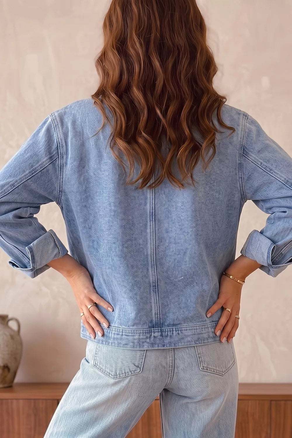 Front view of the studded denim jacket worn open