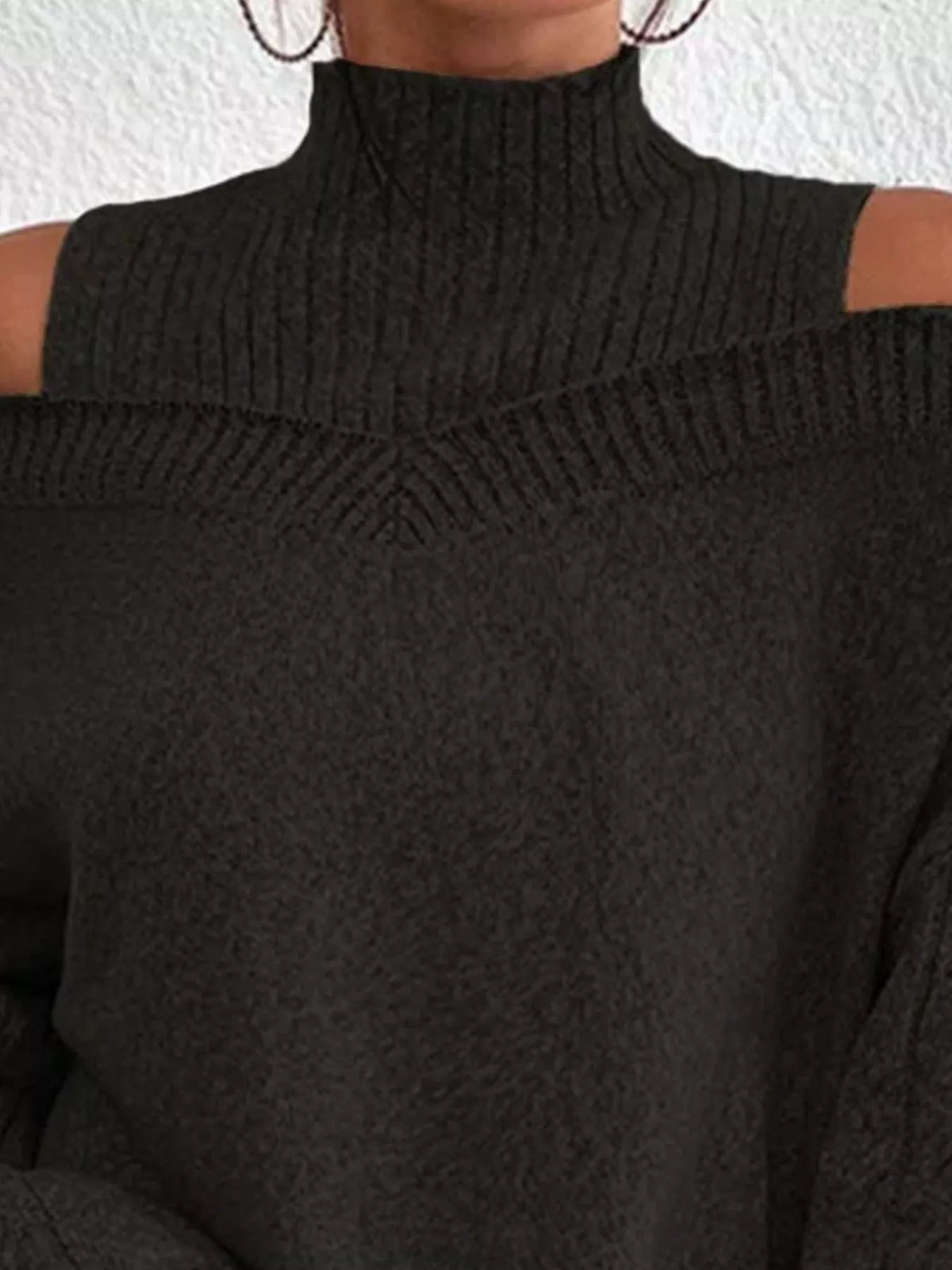 cable knit cold shoulder turtleneck sweater knit texture close up