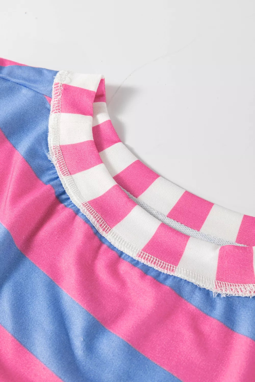 Contrast stripe panels on the oversized pink top