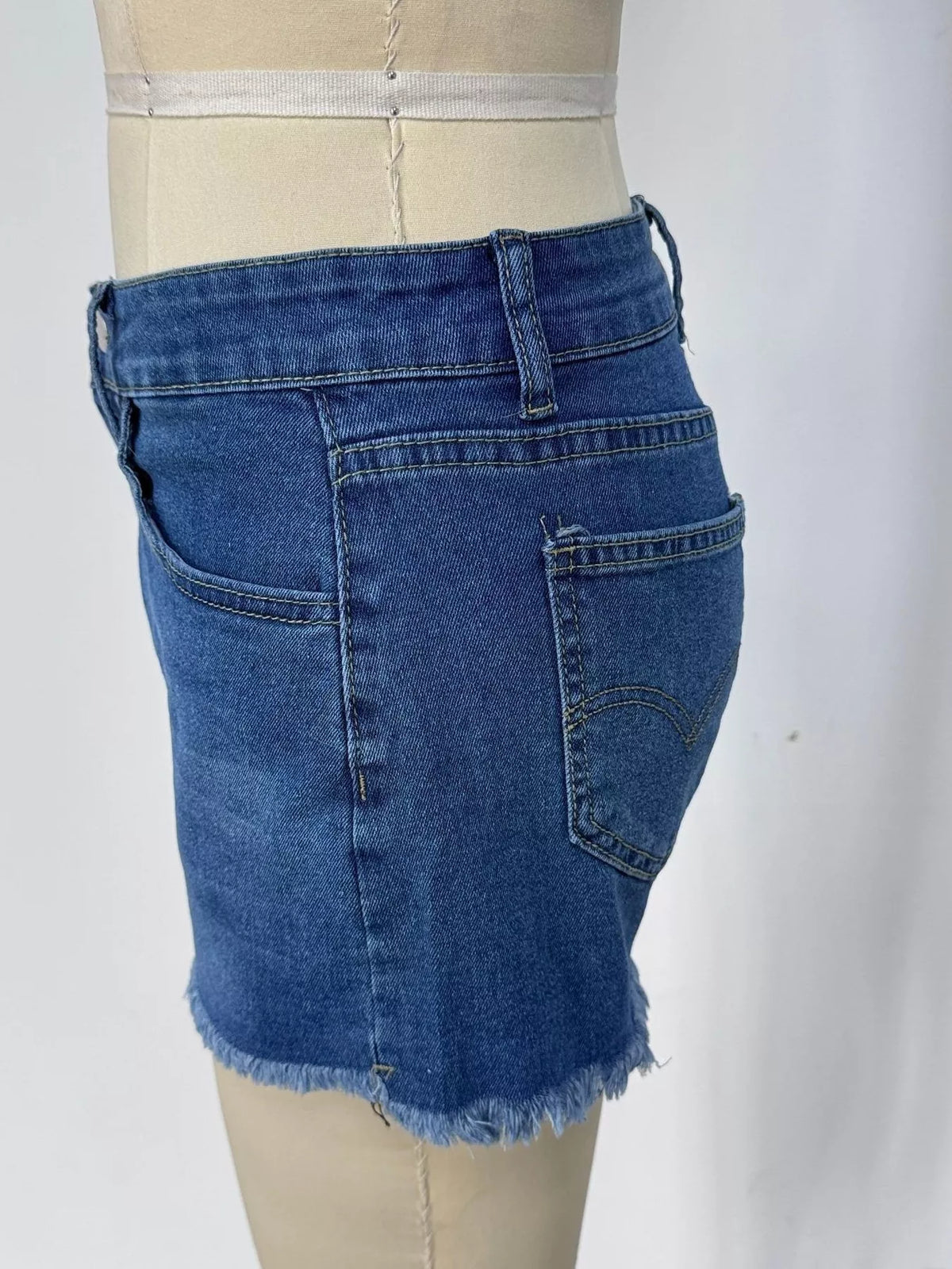 Dark blue denim shorts three quarter view