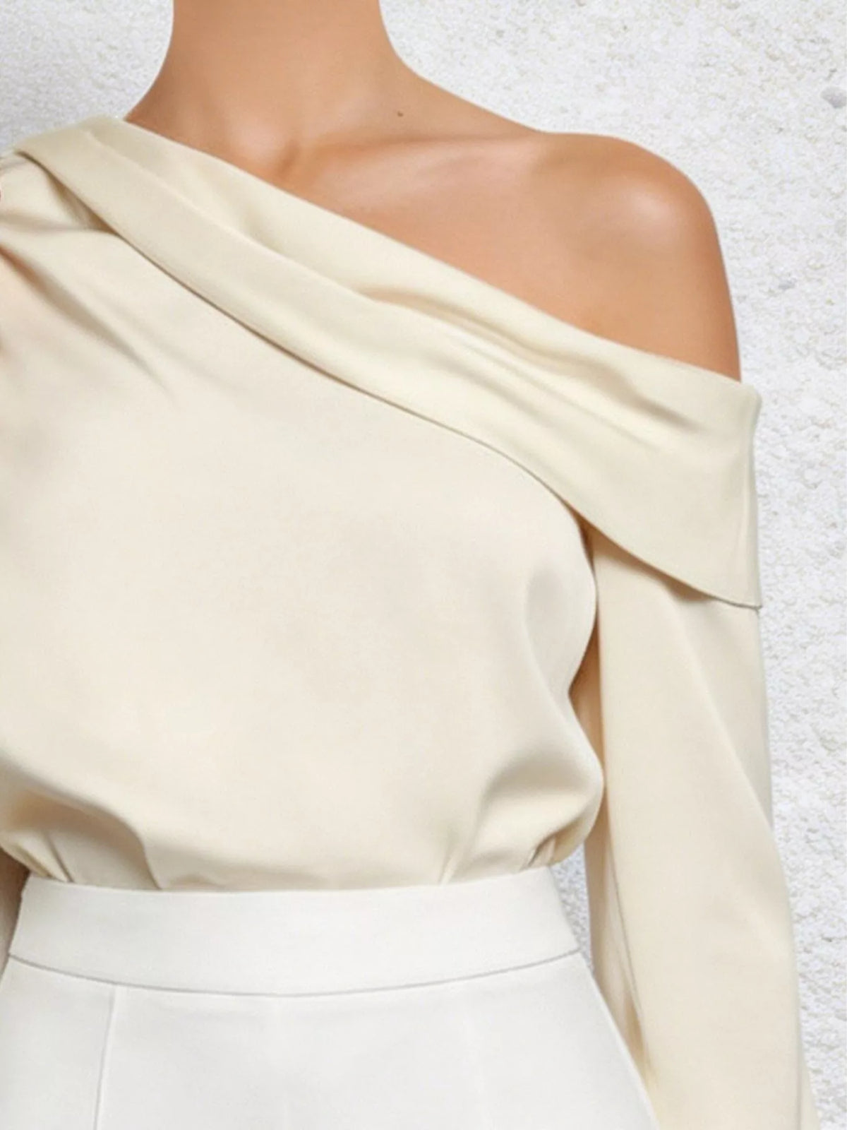 Cream one shoulder long sleeve blouse, back view