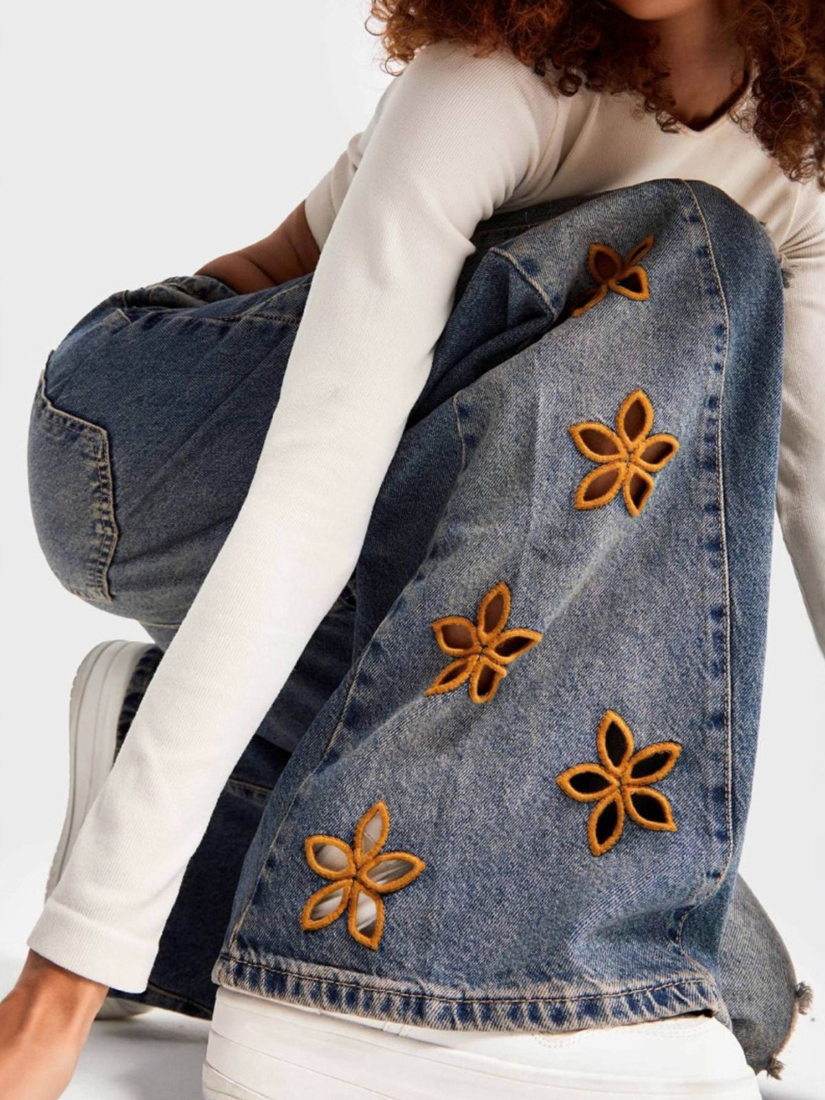 Full length styling of embroidered wide leg jeans