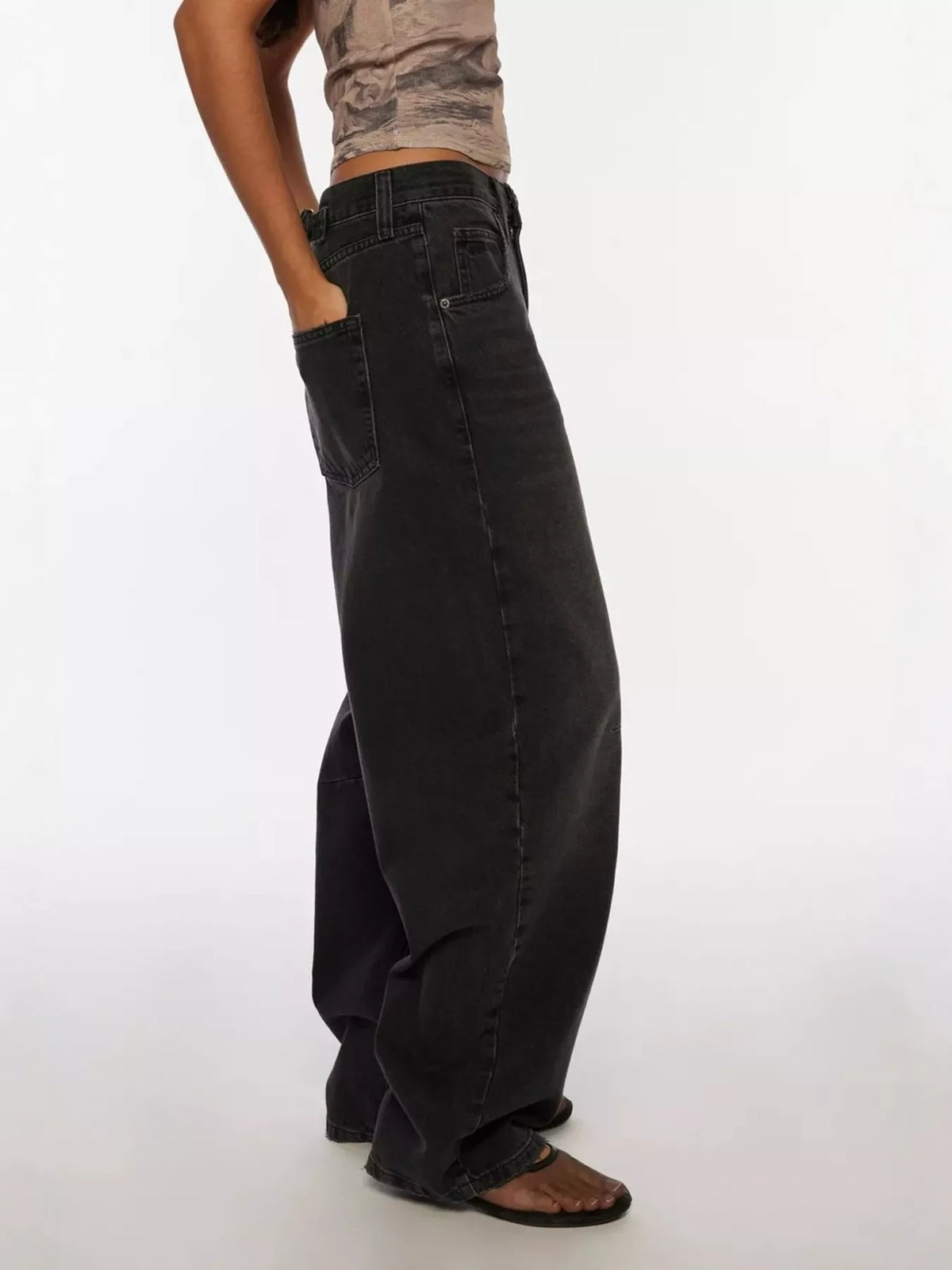 Faded black wide leg denim side profile