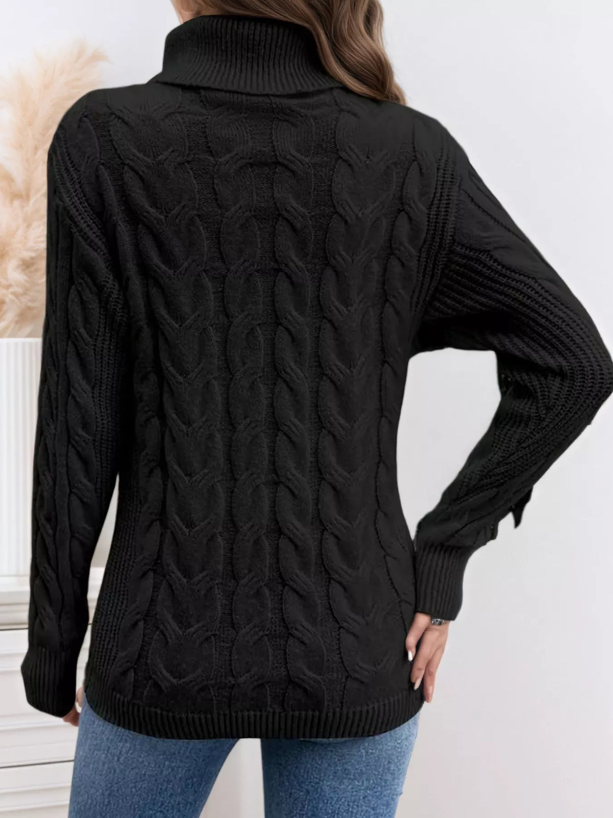 Cable knit turtleneck long sleeve sweater fabric close up