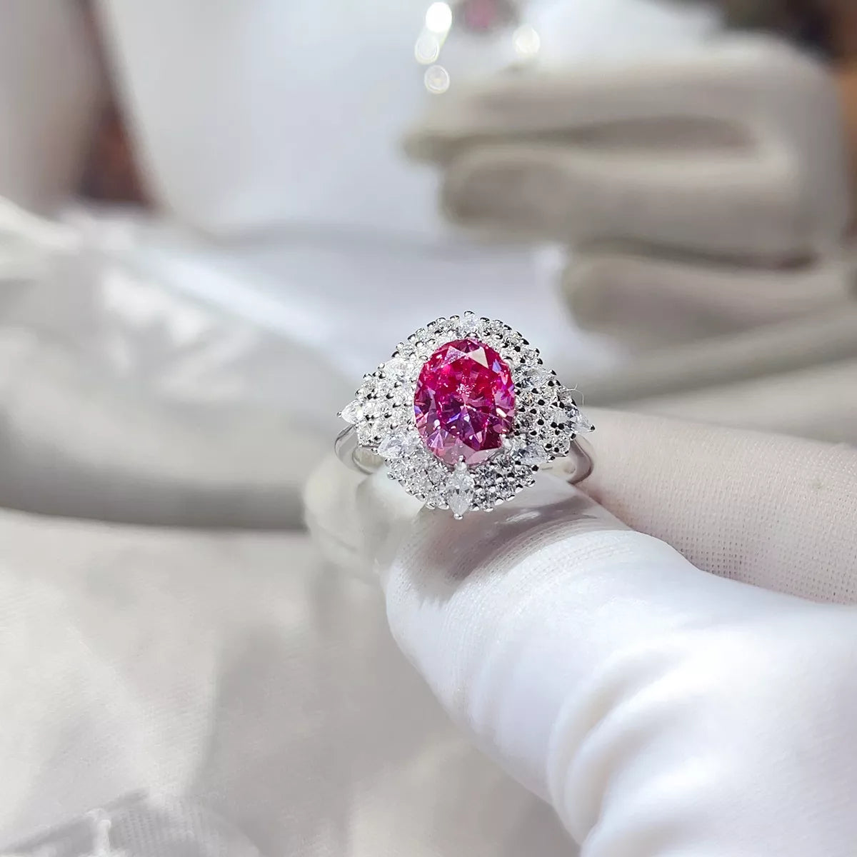 Fuchsia pink moissanite ring shown from the side