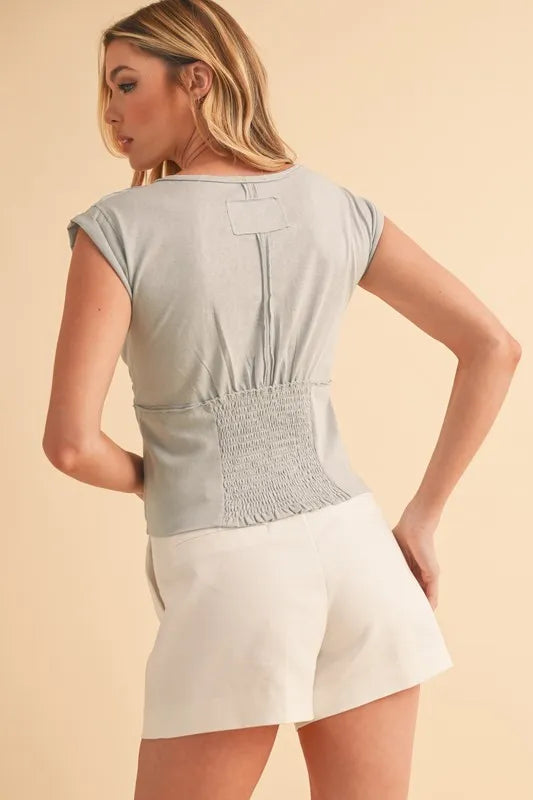 Light blue cap sleeve cropped top on model