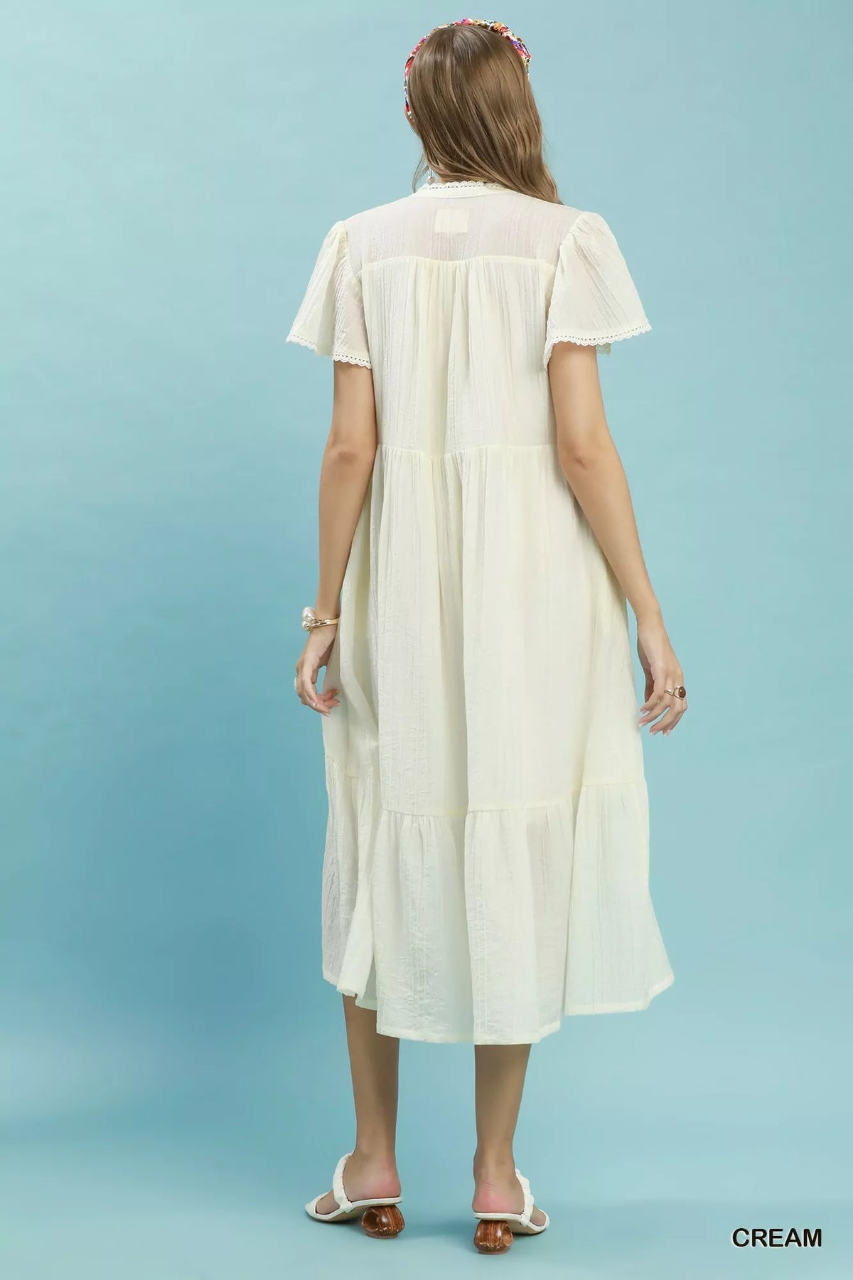 Cream textured lace trim tiered midi dress back view