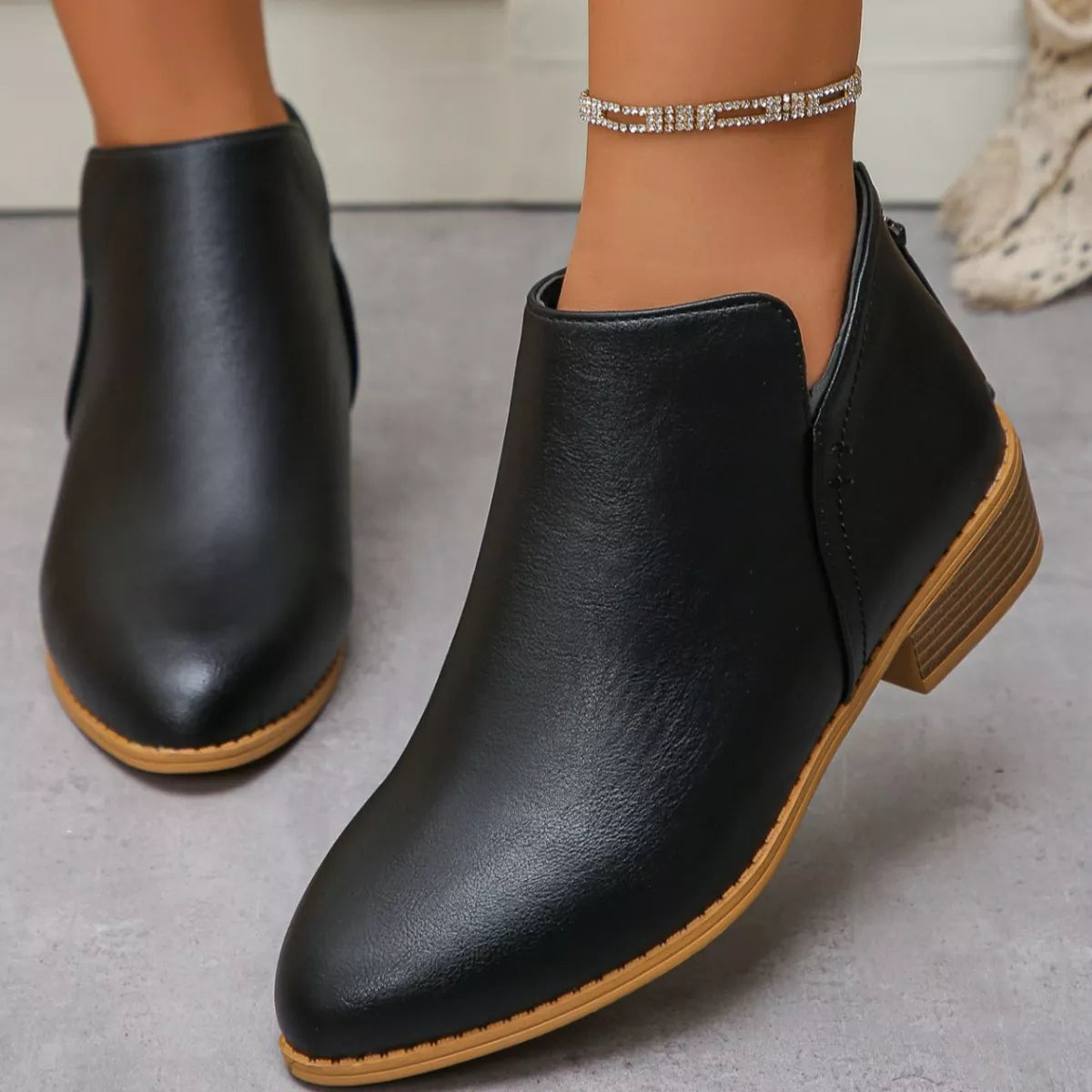 Point toe block heel ankle boots detail of trim