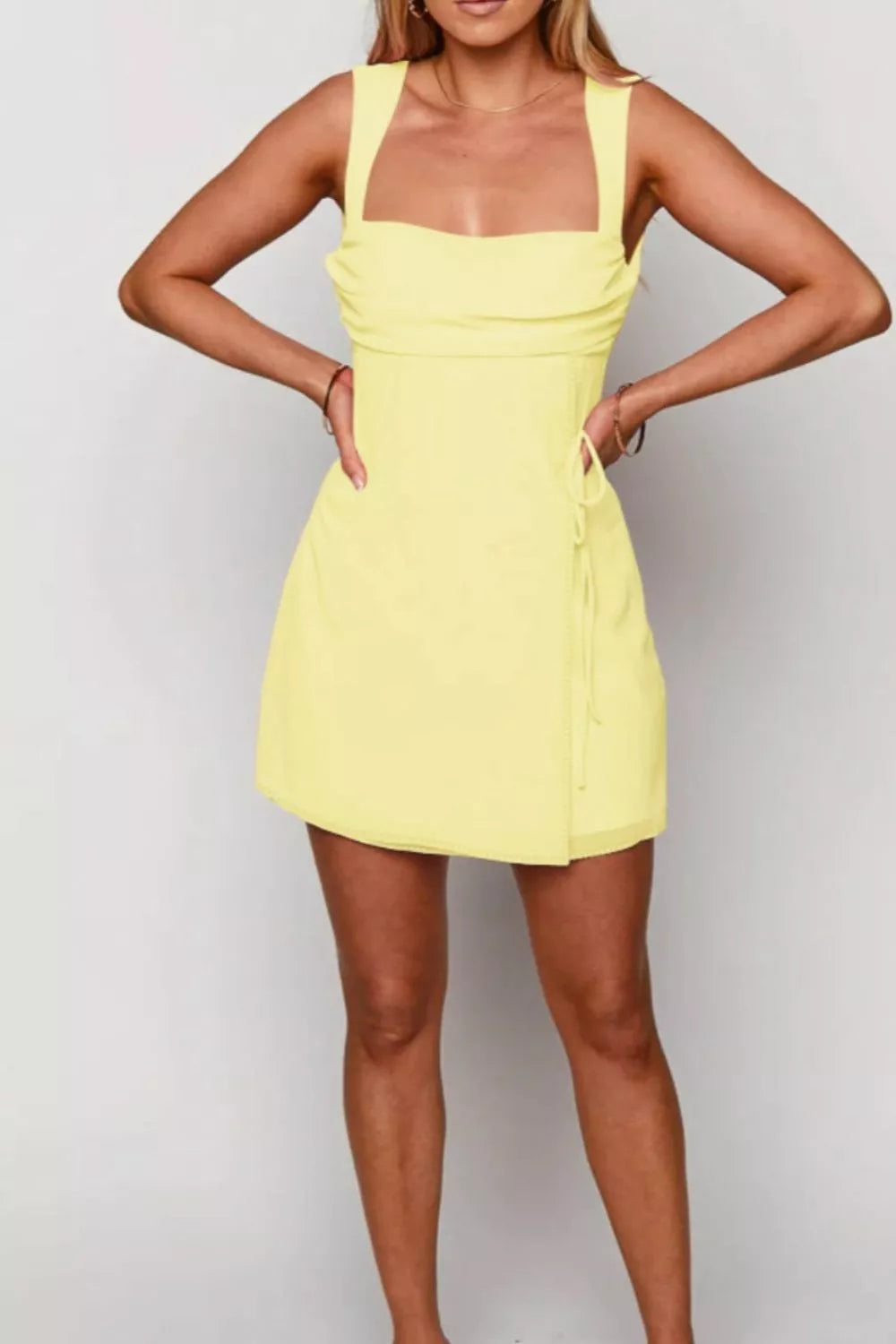 Pastel yellow square neck sleeveless ruched mini dress front view