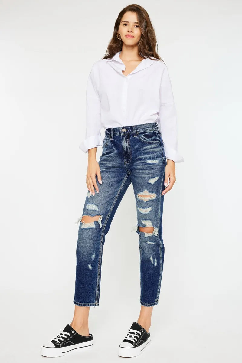 Frayed raw hem on distressed mom jeans