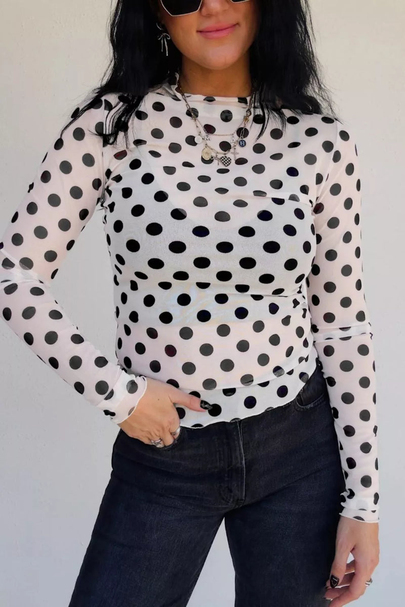 White polka dot sheer mesh long sleeve top front view