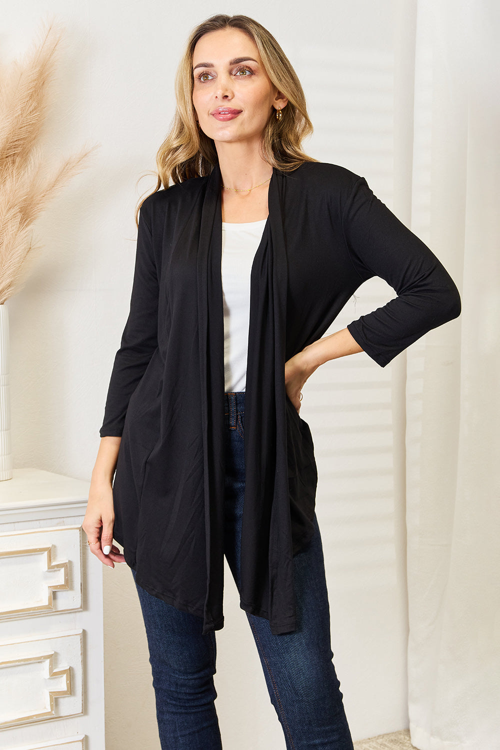 Black open front cardigan worn as a light layer